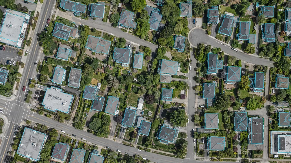 Aerial imagery with building perimeter and rooftop geometry outlines
