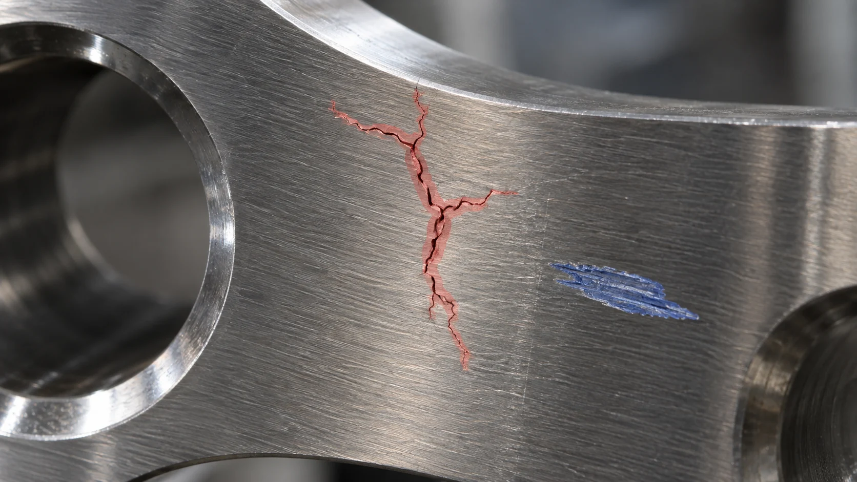 Metal surface cracks and abrasions precisely segmented for inspection